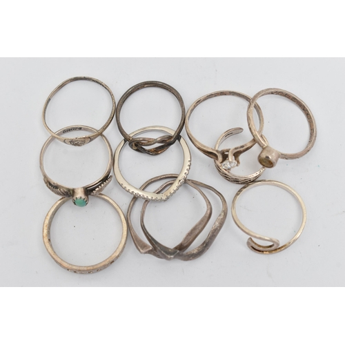 141 - TEN WHITE METAL RINGS, of various designs and sizes, some stamped 925, silver, some unmarked metal (... 