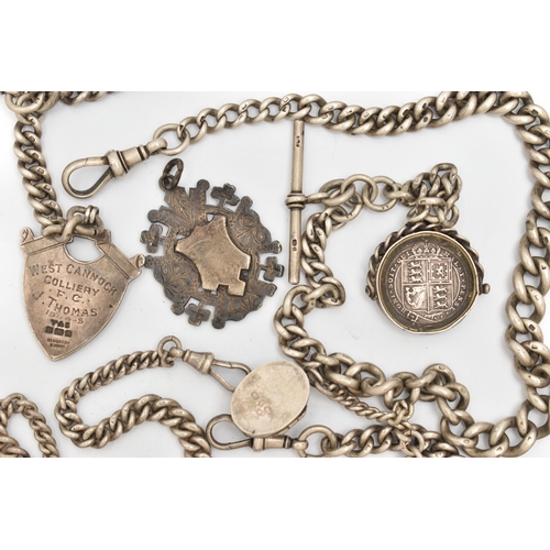 145 - THREE SILVER ALBERT CHAINS WITH FOB MEDALS, LOCKET AND A QUEEN VICTORIA SHILLING COIN, the first a g... 