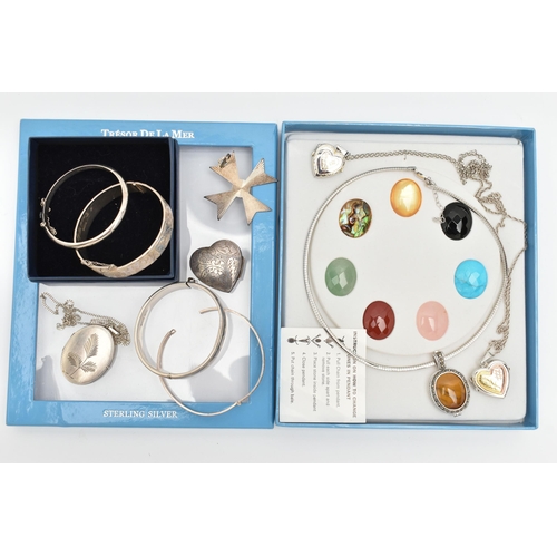 156 - A SELECTION OF SILVER AND WHITE METAL JEWELLERY, to include four hinged bangles, four lockets, a hea... 