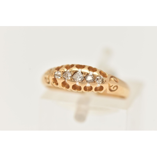 86 - AN 18CT GOLD DIAMOND RING, set with five graduated old cut diamonds, scrolls to the shoulders leadin... 