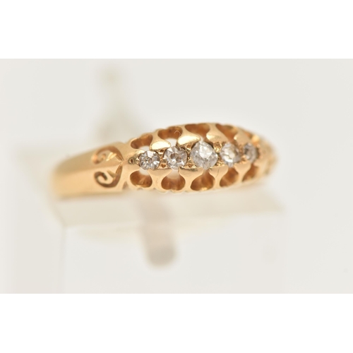 86 - AN 18CT GOLD DIAMOND RING, set with five graduated old cut diamonds, scrolls to the shoulders leadin... 