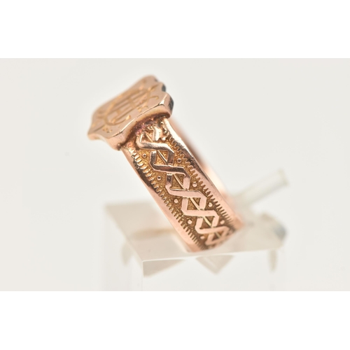 87 - A LATE VICTORIAN 9CT GOLD BAND SIGNET RING, shield shape signet with engraved monogram, to a wide te... 