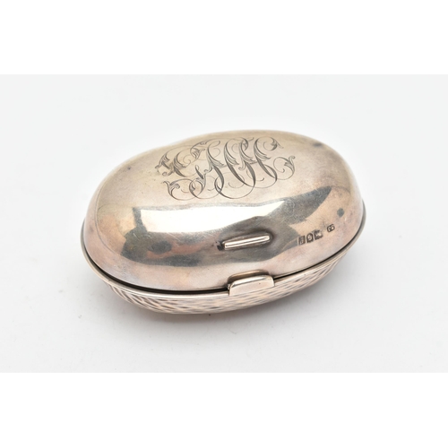 173 - AN EDWARDIAN SILVER SNUFF BOX, of an oval form, engraved monogram to the hinged cover, hammer effect... 