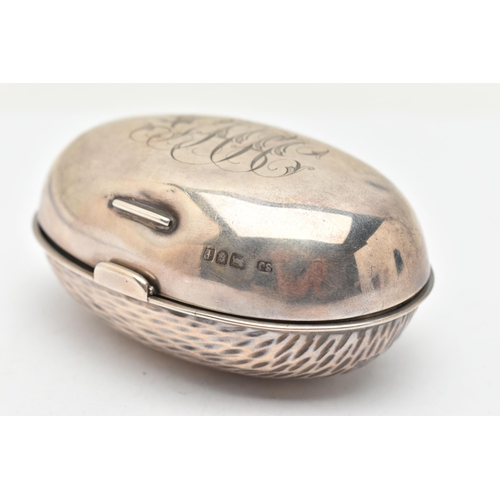 173 - AN EDWARDIAN SILVER SNUFF BOX, of an oval form, engraved monogram to the hinged cover, hammer effect... 