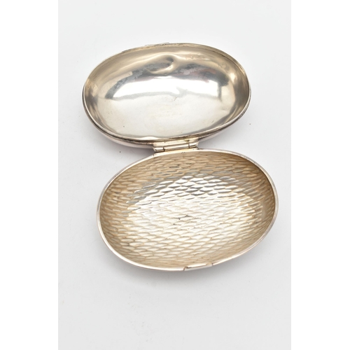 173 - AN EDWARDIAN SILVER SNUFF BOX, of an oval form, engraved monogram to the hinged cover, hammer effect... 
