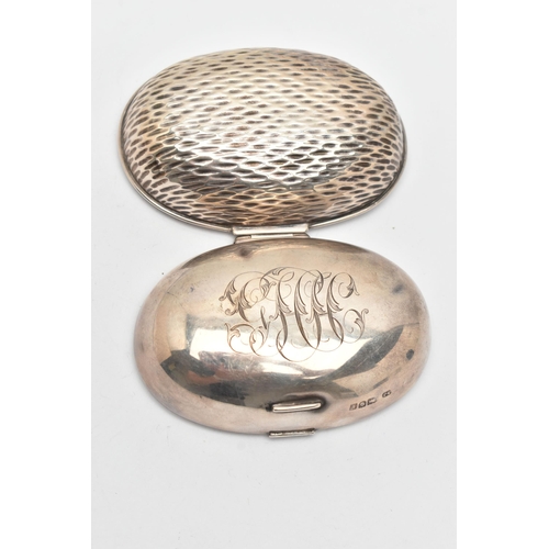 173 - AN EDWARDIAN SILVER SNUFF BOX, of an oval form, engraved monogram to the hinged cover, hammer effect... 