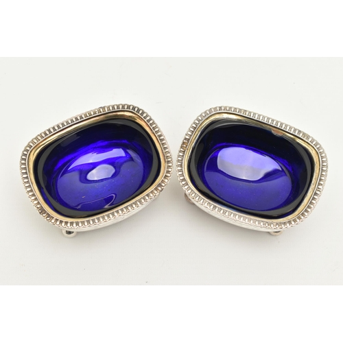 175 - A PAIR OF GEORGIAN SILVER SALTS, rounded rectangular form with gadrooned rims, engraved thistle deta... 