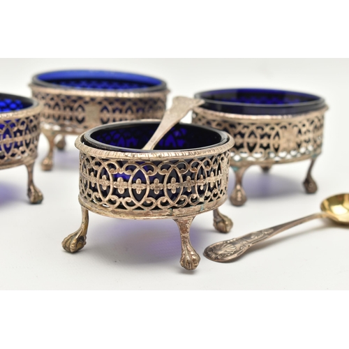 176 - A SET OF FOUR GEORGE III SILVER SALTS WITH TWO SPOONS, each of an oval pierced form with engraved cr... 