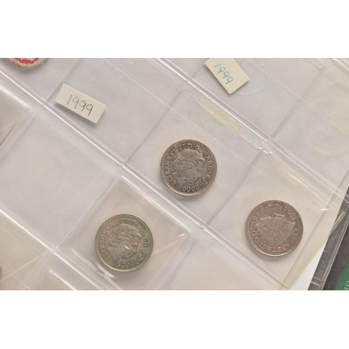 225 - TWO ALBUMS CONTAINING MIXED COINS, to include UK coins with amounts of Silver 3d coins Victoria-Geor... 