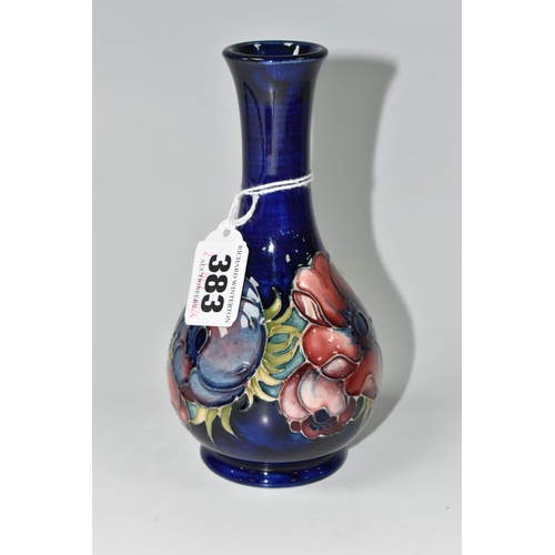 383 - A MOORCROFT POTTERY ANEMONE PATTERN VASE, decorated with mauve anemone on a dark blue ground, impres... 