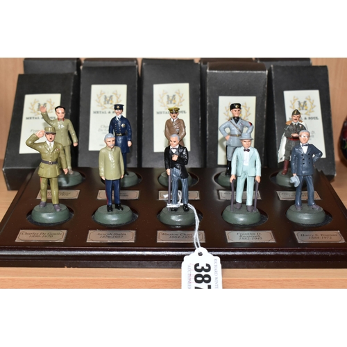 387 - A COLLECTION OF TEN METAL & SOUL MILITARY MINIATURES, together with individual boxes and wooden disp... 