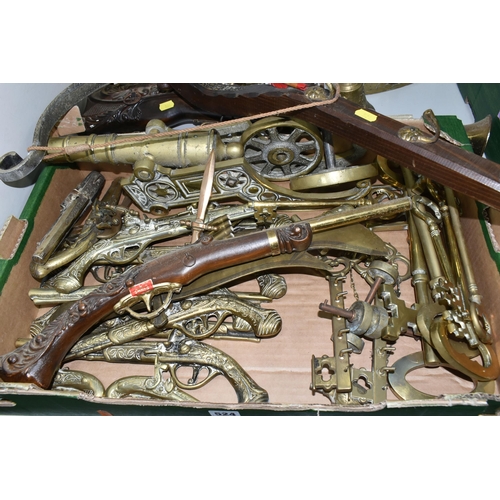 524 - A BOX AND LOOSE BRASSWARE, to include a brass cannon, length 46cm, brass wall plaques in the form of... 