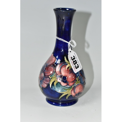 383 - A MOORCROFT POTTERY ANEMONE PATTERN VASE, decorated with mauve anemone on a dark blue ground, impres... 