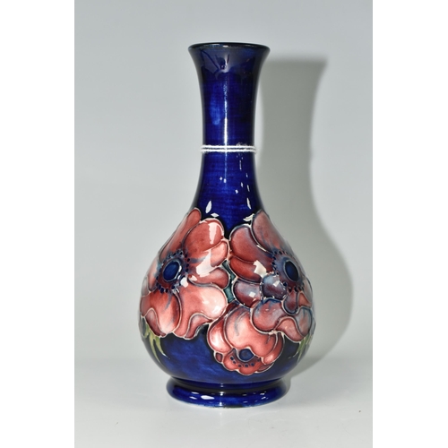 383 - A MOORCROFT POTTERY ANEMONE PATTERN VASE, decorated with mauve anemone on a dark blue ground, impres... 