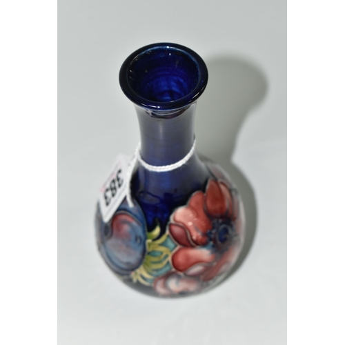 383 - A MOORCROFT POTTERY ANEMONE PATTERN VASE, decorated with mauve anemone on a dark blue ground, impres... 