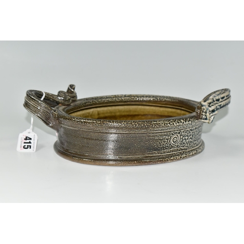 415 - WALTER KEELER (1942): A SALT GLAZED STONEWARE DISH, the oval dish with twin ribbon-style handles, an... 