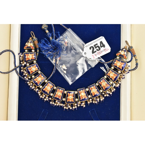 254 - AN ASIAN YELLOW METAL ENAMEL PASTE AND IMITATION PEARL FRINGE NECKLACE, designed as a series of thir... 