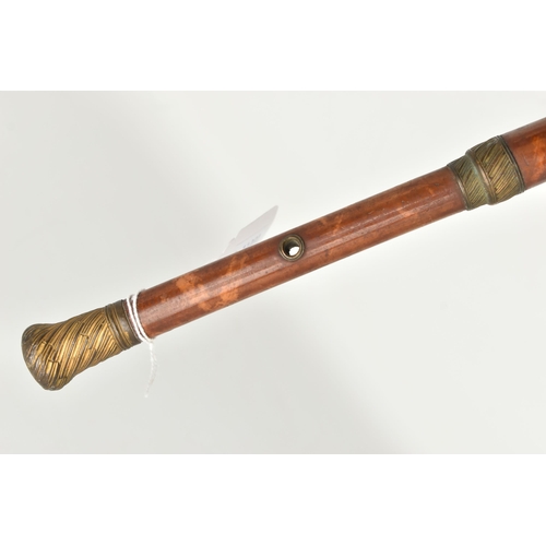 1227A - A REGENCY BAMBOO WALKING CANE, with tooled gilt brass handle and mount, the shaft decorated with a s... 