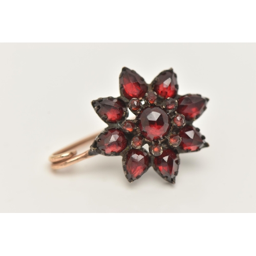 923A - A BOHEMIAN GARNET CONVERSION BROOCH, designed as a flower set in a white metal mount, fitted with a ... 