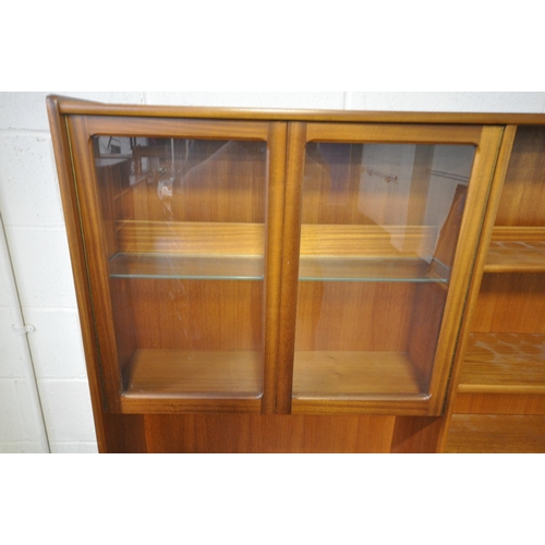 1206 - POSSIBLY NATHAN, A MID CENTURY TEAK HIGHBOARD, fitted with double glass doors, an arrangement of she... 