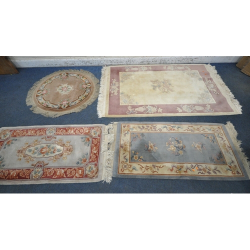 1216 - A CREAM GROUND RECTANGULAR CHINESE WOOLEN RUG, with foliate design, and a border, 200cm x 122cm, alo... 