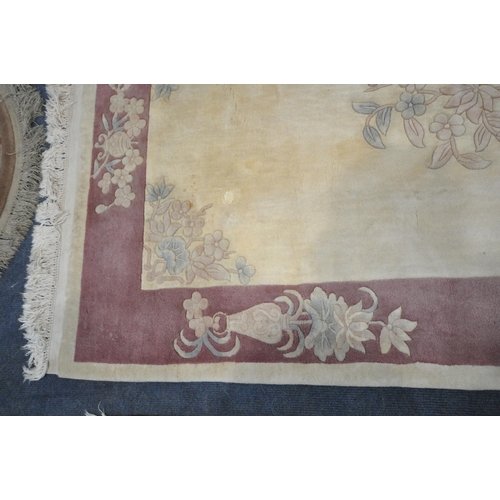 1216 - A CREAM GROUND RECTANGULAR CHINESE WOOLEN RUG, with foliate design, and a border, 200cm x 122cm, alo... 