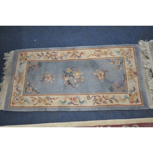 1216 - A CREAM GROUND RECTANGULAR CHINESE WOOLEN RUG, with foliate design, and a border, 200cm x 122cm, alo... 