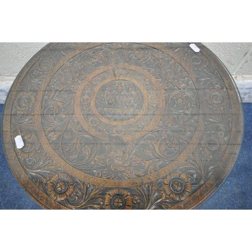 1217 - A 20TH CENTURY HARDWOOD ANGLO-INDIAN CARVED CIRCULAR TABLE, with foliate details, surrounding a Hind... 