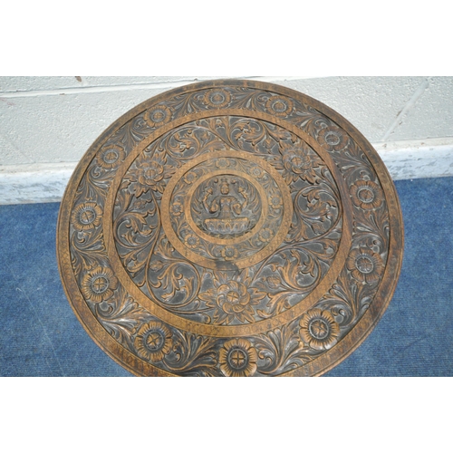 1217 - A 20TH CENTURY HARDWOOD ANGLO-INDIAN CARVED CIRCULAR TABLE, with foliate details, surrounding a Hind... 