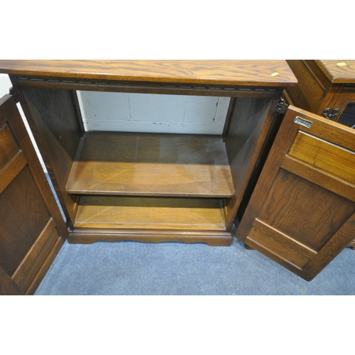 1218 - AN OLD CHARM SOVEREIGN OAK TV CABINET, with double linenfold cupboard doors, width 82cm x depth 49cm... 