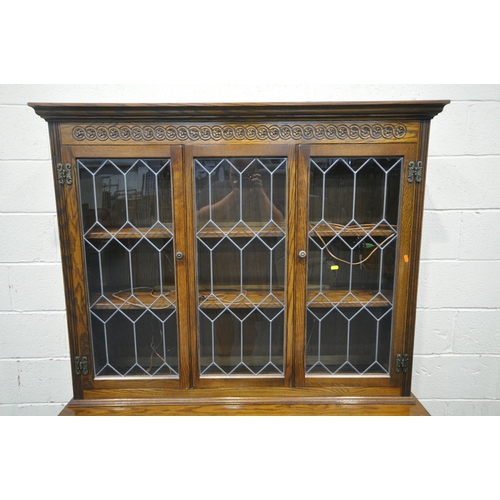 1220 - AN OLD CHARM LANCASTER DRESSER, fitted with three lead glazed doors, atop a base with three drawers,... 