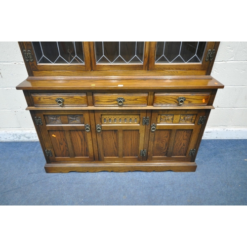 1220 - AN OLD CHARM LANCASTER DRESSER, fitted with three lead glazed doors, atop a base with three drawers,... 