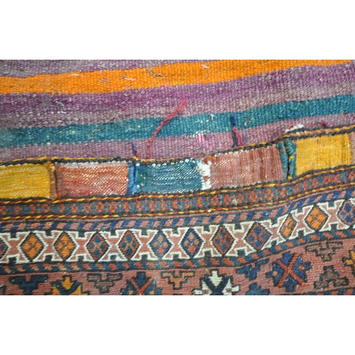 1223 - A LARGE RECTANGULAR KURDISH SADDLE BAG, with repeating geometric patterns, multi-strap borders, and ... 