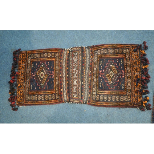 1223 - A LARGE RECTANGULAR KURDISH SADDLE BAG, with repeating geometric patterns, multi-strap borders, and ... 