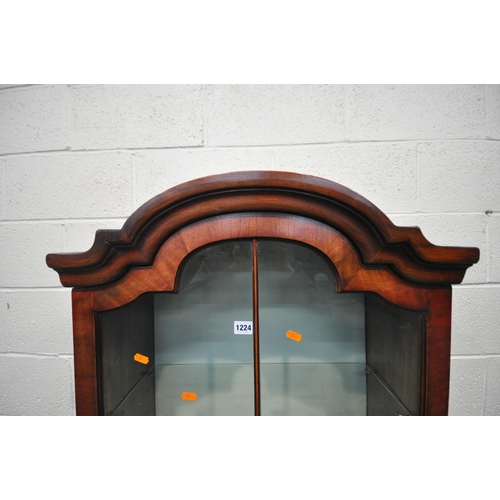 1224 - A REPRODUCTION MAHOGANY DISPLAY CABINET, with a stepped arched top, the single glazed door enclosing... 