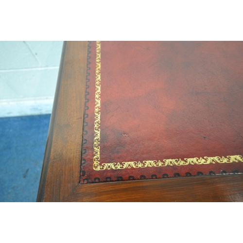 1226 - A 20TH CENTURY MAHOGANY TWIN PEDESTAL DESK, with oxblood leather writing surface, fitted with nine a... 