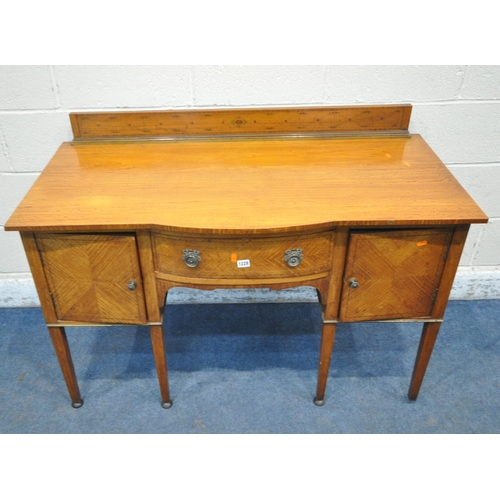 1228 - AN EDWARDIAN SATINWOOD BOWFRONT SIDEBOARD, with a raised back, fitted with two cupboard doors, flank... 