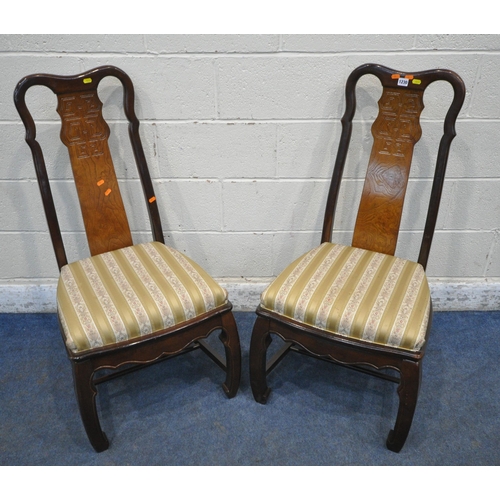 1230 - A PAIR OF ORIENTAL HARDWOOD CHAIRS, with a shaped backrest, central splat, gold stripped upholstery,... 