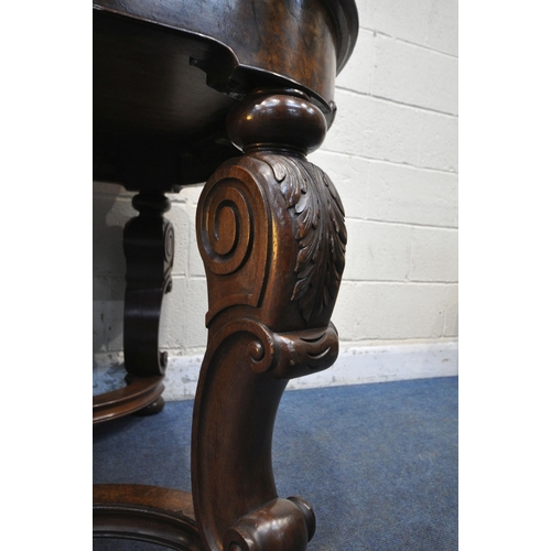 1231 - A 20TH CENTURY BURR WALNUT TABLE, with rounded ends, raised on four scrolled legs, with bun feet, un... 