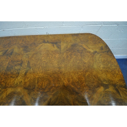 1231 - A 20TH CENTURY BURR WALNUT TABLE, with rounded ends, raised on four scrolled legs, with bun feet, un... 