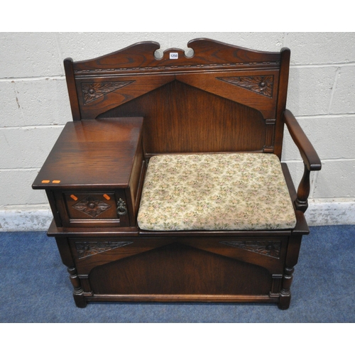 1250 - A LATE 20TH CENTURY OAK TELEPHONE TABLE, with a small cupboard door, and a hinged seat, width 94cm x... 