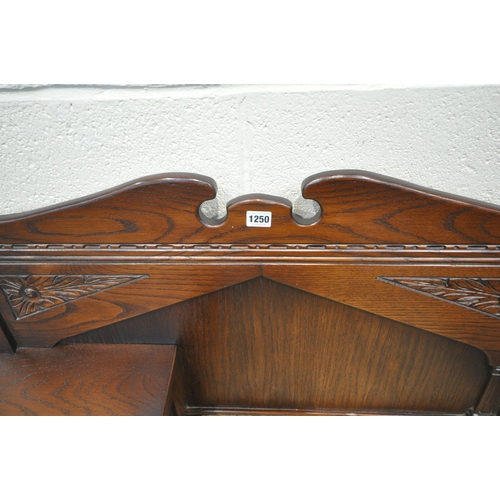 1250 - A LATE 20TH CENTURY OAK TELEPHONE TABLE, with a small cupboard door, and a hinged seat, width 94cm x... 