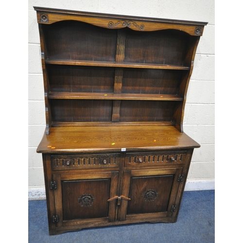 1251 - A LATE 20TH CENTURY OAK DRESSER, the two tier plate rack, atop a base with two drawers, above double... 