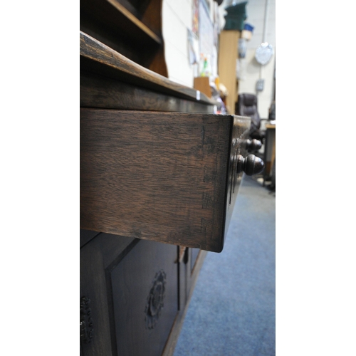 1251 - A LATE 20TH CENTURY OAK DRESSER, the two tier plate rack, atop a base with two drawers, above double... 