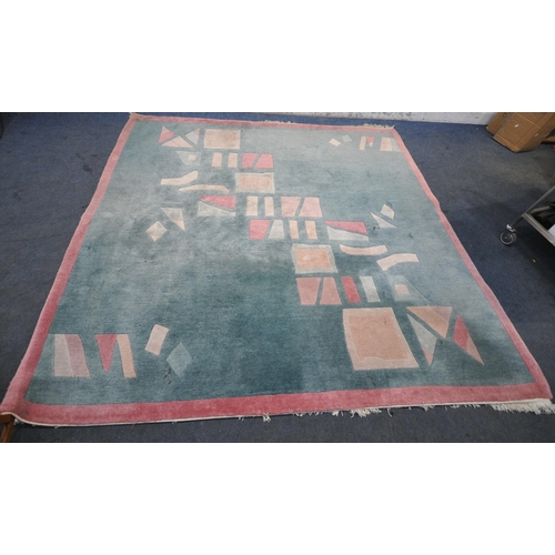 1254 - G H FRITH LIMITED, A LARGE SQUARE HAND KNOTTED WOOLEN NEPALESE RUG, with various geometric shapes, 2... 