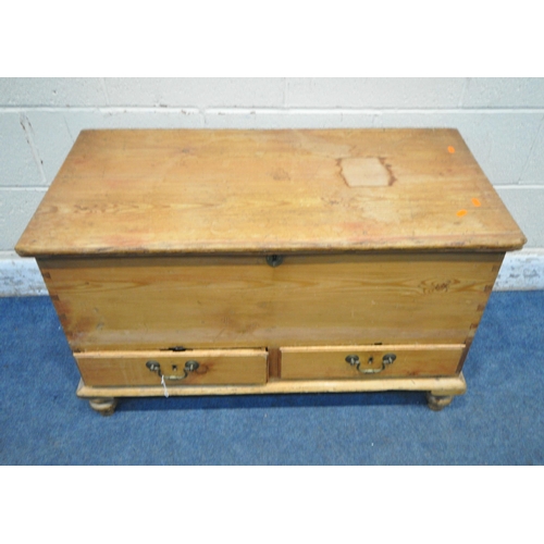 1257 - A 19TH CENTURY PINE BLANKET CHEST, with a hinged lid, and two drawers, raised on turned legs, width ... 