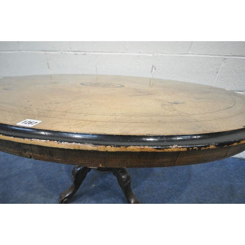 1267 - A 19TH CENTURY WALNUT TILT TOP OVAL LOO TABLE, with marquetry inlay to centre, raised on a turned su... 