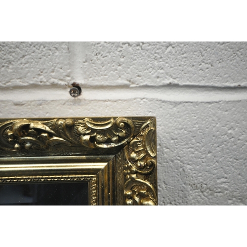 1268 - A LARGE RECTANGULAR GILT FRAME BEVELED EDGE WALL MIRROR, 128cm x 100cm (condition report: small chip... 