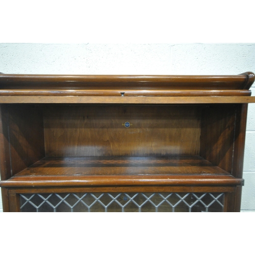 1271 - A 20TH CENTURY OAK GLOBE WERNICKE LIMITED SECTIONAL ELASTIC BOOKCASE, with three lead glazed hide an... 