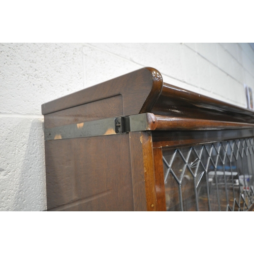 1273 - A 20TH CENTURY OAK GLOBE WERNICKE LIMITED SECTIONAL ELASTIC BOOKCASE, with three lead glazed hide an... 